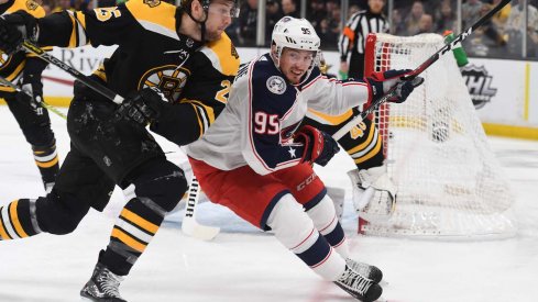 Columbus Blue Jackets center Matt Duchene fights for space against Boston Bruins defenseman Brandon Carlo.