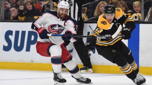  Nick Foligno and Charlie Coyle battle for the puck in Game 2 between the Columbus Blue Jackets and Boston Bruins.