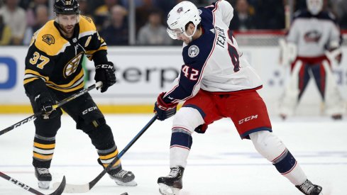 Columbus Blue Jackets center Alexandre Texier (42) battles with Boston Bruins center Patrice Bergeron (37) during the first period in game one of the second round of the 2019 Stanley Cup Playoffs at TD Garden.