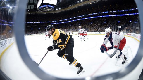  Boston Bruins left wing Jake DeBrusk (74) and Columbus Blue Jackets center Brandon Dubinsky (17) chase after the puck during the second period in game two of the second round of the 2019 Stanley Cup Playoffs at TD Garden