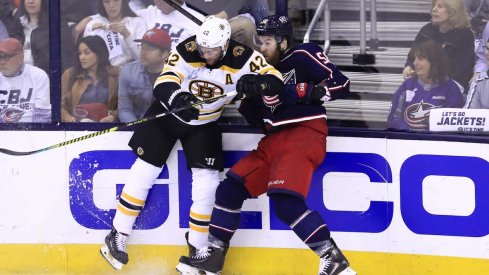 Columbus Blue Jackets defenseman David Savard collides with Boston Bruins forward David Backes during Game 6 at Nationwide Arena.