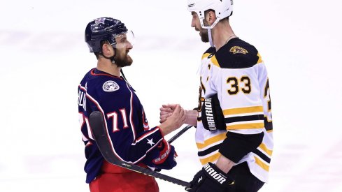 Nick Foligno shakes hands with Boston Bruins defenseman Zdeno Chara