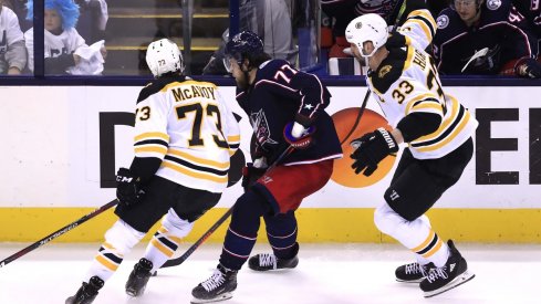 Boston Bruins defenseman Charlie McAvoy (73) is called for an illegal check to the head against Columbus Blue Jackets right wing Josh Anderson (77) in the second period during game six of the second round of the 2019 Stanley Cup Playoffs at Nationwide Arena.