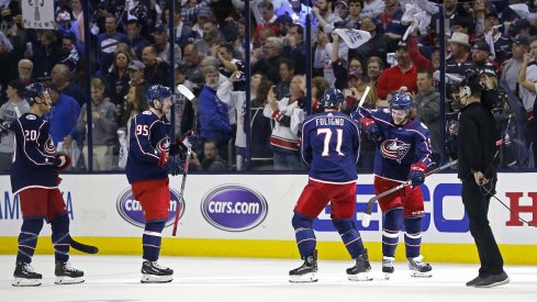 Matt Duchene, Nick Foligno and Artemi Panarin celebrate after defeating the Boston Bruins in game three of the second round of the 2019 Stanley Cup Playoffs