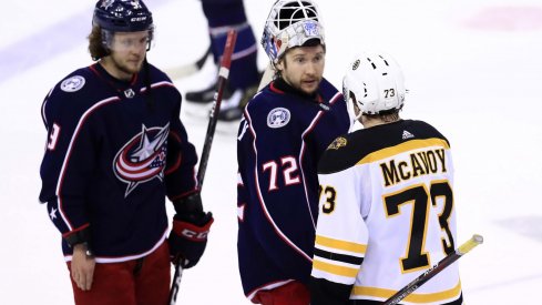 Columbus Blue Jackets goaltender Sergei Bobrovsky (72) shakes hands with Boston Bruins defenseman Charlie McAvoy (73) after game six of the second round of the 2019 Stanley Cup Playoffs at Nationwide Arena.
