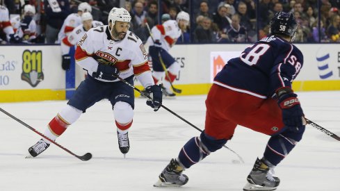 Florida Panthers captain Derek MacKenzie (17) skates with the puck against his former team, the Columbus Blue Jackets, during a game at Nationwide Arena.