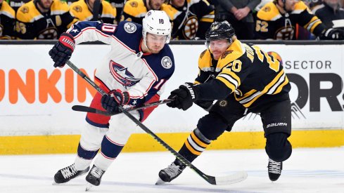 Mar 16, 2019; Boston, MA, USA; Columbus Blue Jackets center Alexander Wennberg (10) and Boston Bruins center Joakim Nordstrom (20) battle for control of the puck during the first period of a game at the TD Garden.