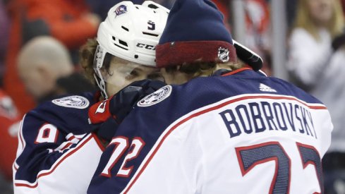 Columbus Blue Jackets forward Artemi Panarin and goaltender Sergei Bobrovsky celebrate with one another after defeating the Washington Capitals in overtime