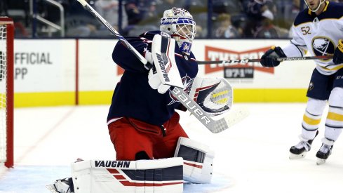 Columbus Blue Jackets goaltender Matiss Kivlenieks (80) makes a save in net against the Buffalo Sabres in the first period at Nationwide Arena