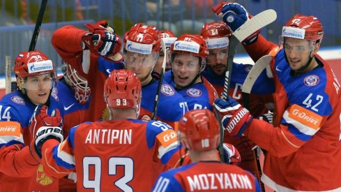 Russian forwards celebrate after scoring a goal.