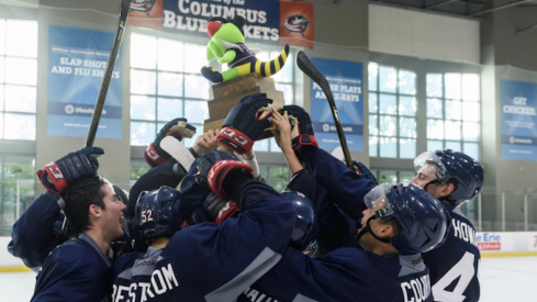 Columbus Blue Jackets prospects celebrate a tournament title at the OhioHealth Ice Haus in Columbus.