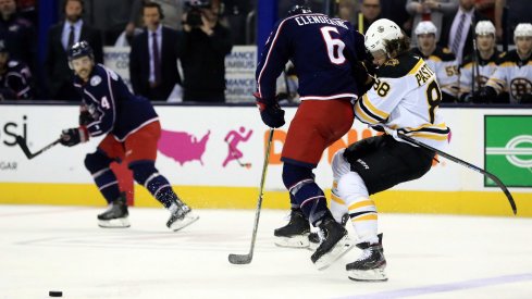 May 2, 2019; Columbus, OH, USA; Columbus Blue Jackets defenseman Adam Clendening (6) checks Boston Bruins right wing David Pastrnak (88) in the first period during game four of the second round of the 2019 Stanley Cup Playoffs at Nationwide Arena.