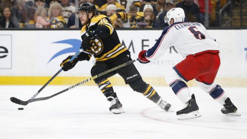 Columbus Blue Jackets defenseman Adam Clendening defends against Boston Bruins forward David Pastrnak during the Stanley Cup Playoffs.