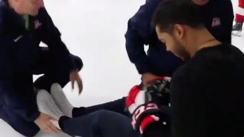 Blue Jackets defeneseman Seth Jones tries out sled hockey with people from USA Hockey
