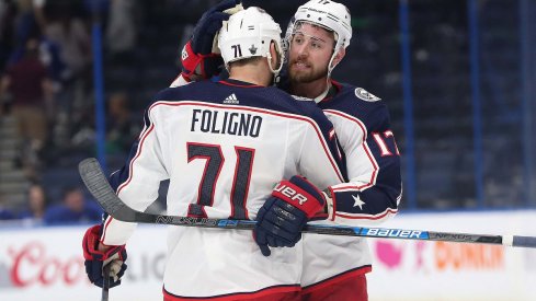 Nick Foligno and Brandon Dubinsky celebrate a road win against the Tampa Bay Lightning