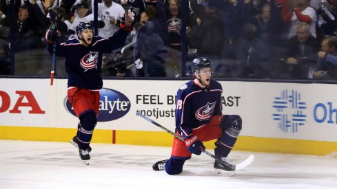 Apr 16, 2019; Columbus, OH, USA; Columbus Blue Jackets right wing Oliver Bjorkstrand (left) reacts to the goal scored by center Pierre-Luc Dubois (right) against the Tampa Bay Lightning in the first period during game four of the first round of the 2019 Stanley Cup Playoffs at Nationwide Arena. 