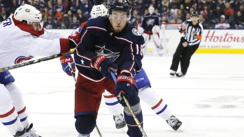 Columbus Blue Jackets center Pierre-Luc Dubois attempts to fend off Shea Weber, defenseman for the Montreal Canadiens during a regular-season matchup at Nationwide Arena during January of 2019.