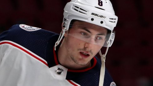 Werenski looks on in warm-ups against the Montreal Canadiens