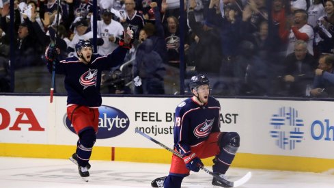 Columbus Blue Jackets right wing Oliver Bjorkstrand (left) reacts to the goal scored by center Pierre-Luc Dubois (right) against the Tampa Bay Lightning in the first period during game four of the first round of the 2019 Stanley Cup Playoffs at Nationwide Arena. 