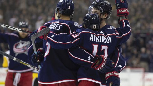 Seth Jones and Cam Atkinson celebrate a Blue Jackets goal scored against the Pittsburgh Penguins at Nationwide Arena.