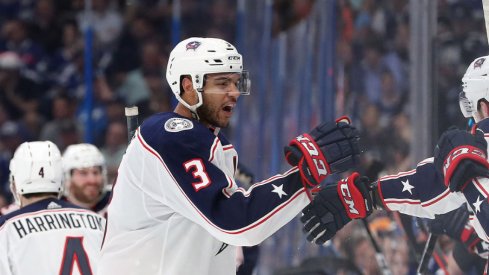 Columbus Blue Jackets defenseman Seth Jones skates towards his teammates on the bench to celebrate a goal against the Tampa Bay Lightning at Amalie Arena during the first round of the 2019 Stanley Cup Playoffs.
