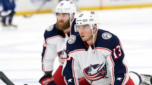 Columbus Blue Jackets defenseman David Savard and forward Cam Atkinson stretch on the ice prior to game two of the first round of the 2019 Stanley Cup Playoffs against the Tampa Bay Lightning at Amalie Arena.