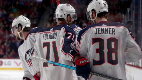 Columbus Blue Jackets forwards Nick Foligno, Boone Jenner and Josh Anderson celebrate a goal against the Montreal Canadiens at the Bell Centre in February of 2019.