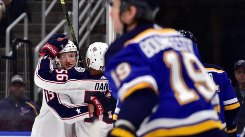 Sep 22, 2019; St. Louis, MO, USA; Columbus Blue Jackets left wing Jacob Lilja (15) is congratulated by center Marko Dano (56) after scoring during the first period against the St. Louis Blues at Enterprise Center.