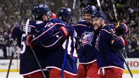 Columbus Blue Jackets defensemen Zach Werenski and Seth Jones celebrate with forwards Alexandre Texier and Nick Foligno during Game 4 of the first round of the 2019 Stanley Cup Playoffs at Nationwide Arena against the Tampa Bay Lightning.