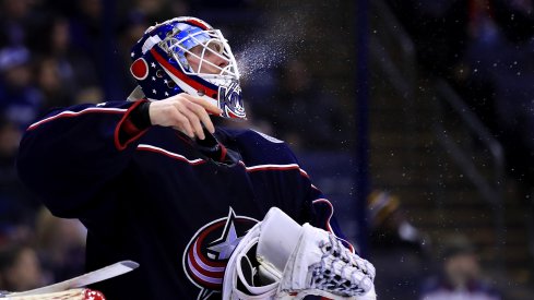 Columbus Blue Jackets goaltender Joonas Korpisalo (70) spits water from his Gatorade bottle during a stop in play against the Tampa Bay Lightning at Nationwide Arena.