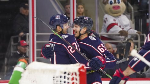 Markus Nutivaara and Ryan Murray celebrate a goal