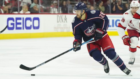 Oliver Bjorkstrand skates with the puck against the Carolina Hurricanes