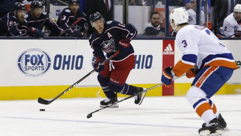 Mar 26, 2019; Columbus, OH, USA; Columbus Blue Jackets right wing Cam Atkinson (13) looks to pass as New York Islanders defenseman Adam Pelech (3) defends during the second period at Nationwide Arena.
