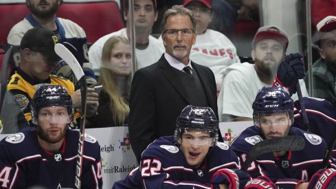 Oct 12, 2019; Raleigh, NC, USA; Carolina Hurricanes head coach John Tortorella looks on from behind the p[layers bench against the Carolina Hurricanes at PNC Arena. The Columbus Blue Jackets defeated the Carolina Hurricanes 3-2.