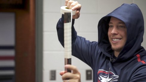 Cam Atkinson tapes his stick during the "Tools of the Trade" segment from the Columbus Blue Jackets.