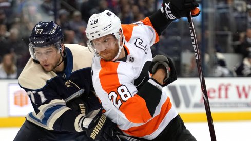 Oct 18, 2018; Columbus, OH, USA; Columbus Blue Jackets right wing Josh Anderson (77) skates against Philadelphia Flyers center Claude Giroux (28) at Nationwide Arena.