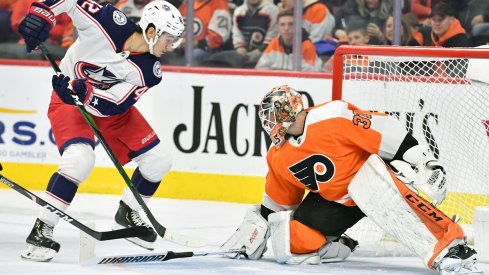  Philadelphia Flyers goaltender Brian Elliott (37) makes a save as Columbus Blue Jackets center Alexandre Texier (42) reaches for rebound during the first period at Wells Fargo Center.