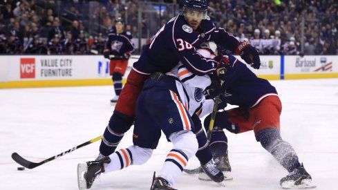 Mar 2, 2019; Columbus, OH, USA; Columbus Blue Jackets center Boone Jenner (38) is called for a holding penally against Edmonton Oilers center Connor McDavid (97) in the third at Nationwide Arena.