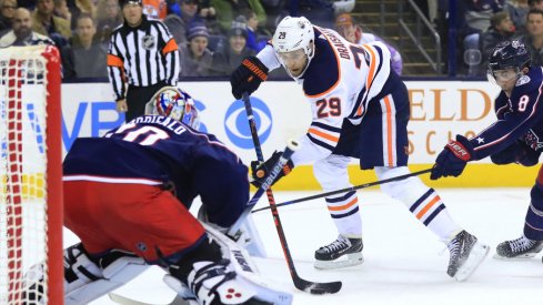 Columbus Blue Jackets goaltender Joonas Korpisalo is pictured preparing for a shot from Edmonton Oilers forward Leon Draisaitl in a regular-season matchup at Nationwide Arena in March of 2019.