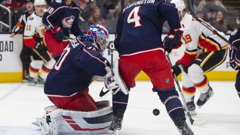 Nov 2, 2019; Columbus, OH, USA; Columbus Blue Jackets goaltender Joonas Korpisalo (70) deflects a shot during the game against the Calgary Flames at Nationwide Arena.