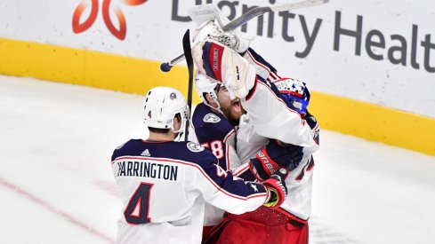 Columbus Blue Jackets goaltender Joonas Korpisalo (70) celebrates with teammates after defeating the Arizona Coyotes at Gila River Arena. 