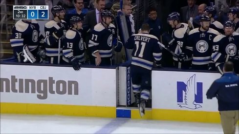 Matt Calvert heads off the ice to receive treatment after taking a shot to the face.