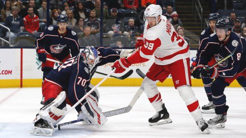 Columbus Blue Jackets goalie Joonas Korpisalo (70) makes a stick save against the Detroit Red Wings during the first period at Nationwide Arena.