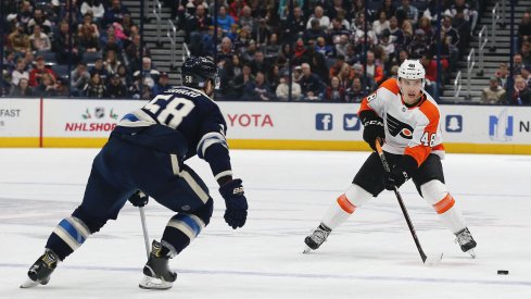 Nov 27, 2019; Columbus, OH, USA; Philadelphia Flyers center Morgan Frost (48) passes the puck against the Columbus Blue Jackets during the first period at Nationwide Arena.