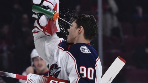 Columbus Blue Jackets goalie Elvis Merzlikins (90) splashes some water on his face during the first period of the game against the Montreal Canadiens at the Bell Centre.