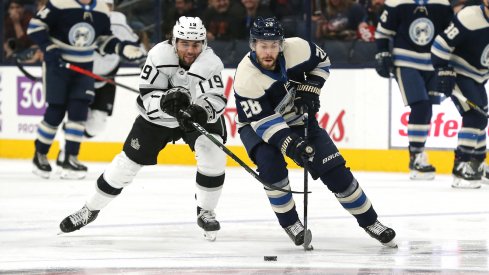 Dec 19, 2019; Columbus, OH, USA; Columbus Blue Jackets right wing Oliver Bjorkstrand (28) skates with the puck as Los Angeles Kings left wing Alex Iafallo (19) defends during the first period at Nationwide Arena. Mandatory Credit: Russell LaBounty-USA TODAY Sports