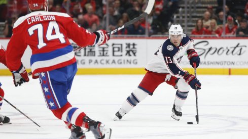 Dec 9, 2019; Washington, DC, USA; Columbus Blue Jackets right wing Cam Atkinson (13) skates with the puck as Washington Capitals defenseman John Carlson (74) defends in the first period at Capital One Arena.