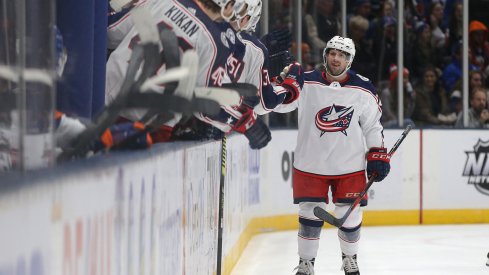 Dec 23, 2019; Uniondale, New York, USA; Columbus Blue Jackets left wing Nathan Gerbe (24) celebrates his goal against the New York Islanders with teammates during the second period at Nassau Veterans Memorial Coliseum. Mandatory Credit: Brad Penner-USA TODAY Sports