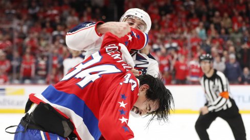 Dec 27, 2019; Washington, District of Columbia, USA; Columbus Blue Jackets left wing Nick Foligno (71) fights Washington Capitals defenseman Jonas Siegenthaler (34) in the second period at Capital One Arena.