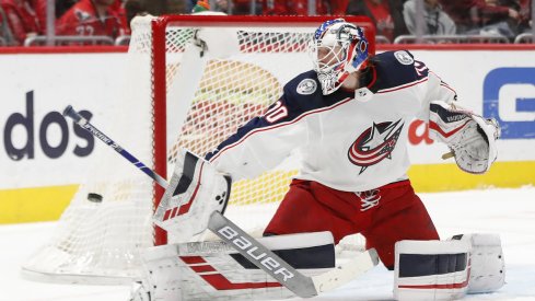 Dec 27, 2019; Washington, District of Columbia, USA; Columbus Blue Jackets goaltender Joonas Korpisalo (70) makes a save against the Washington Capitals in the first period at Capital One Arena. Mandatory Credit: Geoff Burke-USA TODAY Sports